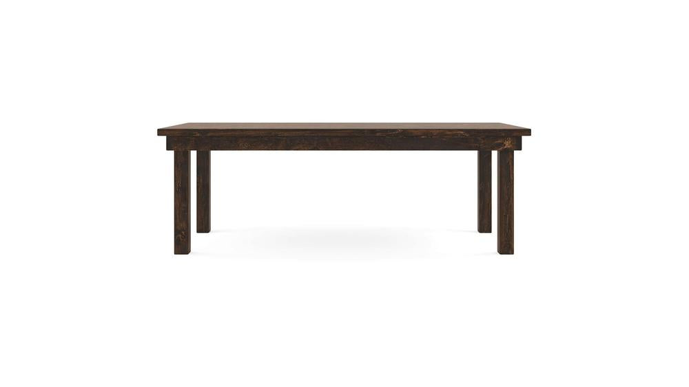 The Farmhouse Dining Table - Tobacco by James+James is a simple wooden table featuring a dark brown finish. Its rectangular top is supported by four straight legs, showcasing a minimalist and functional design that fits seamlessly into various home or office settings. The background is plain white.