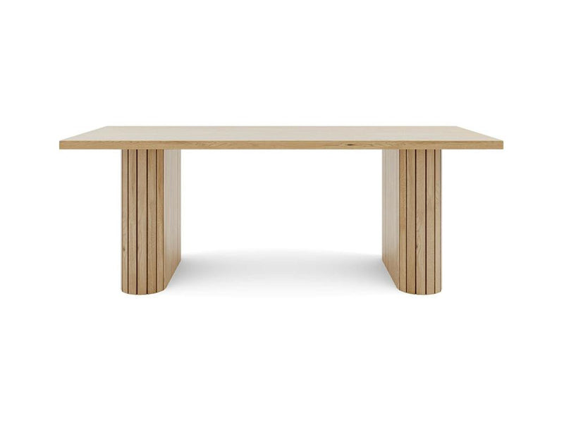 Introducing the James+James Fern Dining Table - Satin, a rectangular wooden table with a simple and modern design. It features a smooth, flat top and two sturdy, vertical paneled legs positioned at each end for solid support. The table boasts a natural wood finish and clean lines.