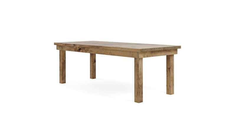 The Farmhouse Dining Table - Harvest Wheat by James+James is a simple, rectangular wooden table with a natural finish. It boasts a sturdy, minimalist design featuring thick legs and a smooth flat top, making it suitable for dining or work. The table stands on a white background.