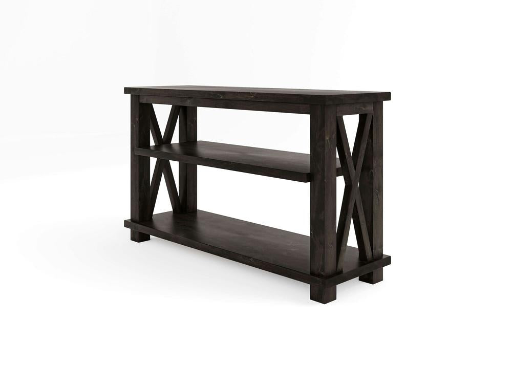 The Carter X Sofa Table - Charred Ember by James+James is a three-tiered black wooden console table featuring an open design. It has X-shaped side frames and a wide top surface, providing ample storage space on all the shelves. The background is white.