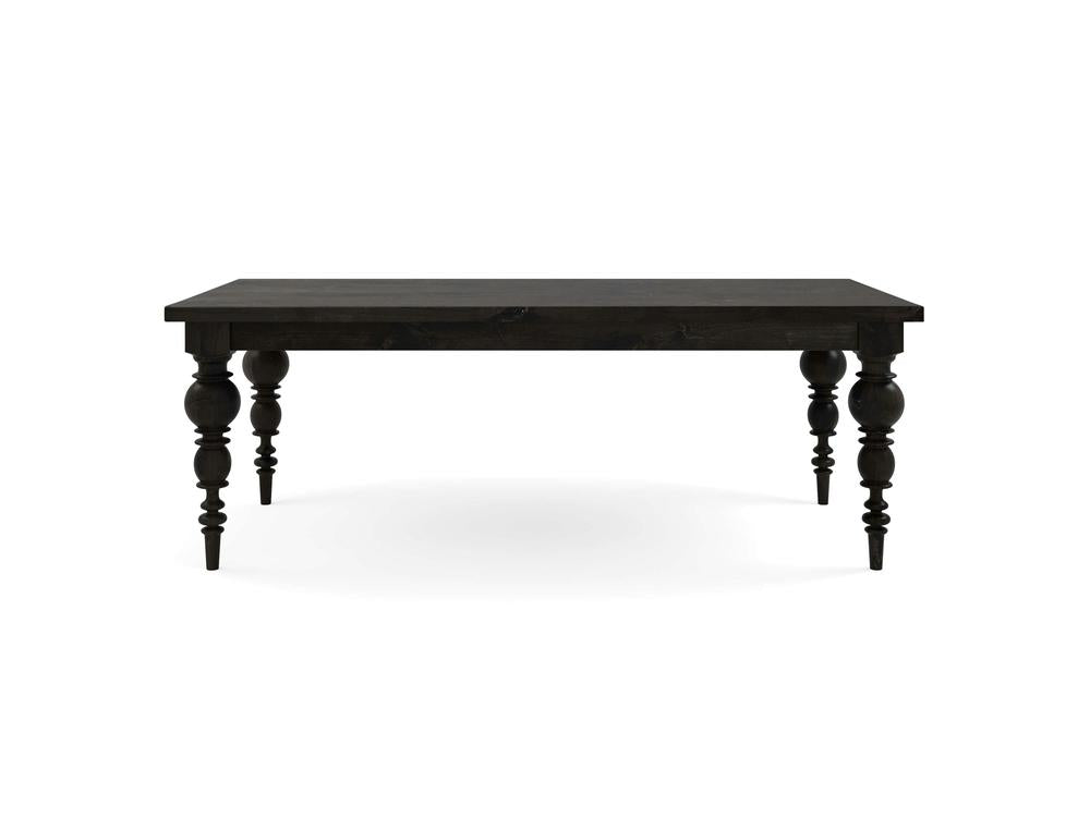 The Bailey Dining Table - Charred Ember by James+James features a rectangular top and intricately carved, spindle-style legs made from dark wood. This dining table exudes a classic, elegant design and stands on four sturdy legs. Set against a white background, the detailed craftsmanship of the table is beautifully highlighted.