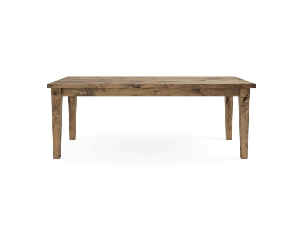 Ava Parsons Dining Table - Harvest Wheat by James+James is a simple wooden dining table made from light brown wood, featuring a rectangular top and four straight legs. The table's minimalist design showcases the natural grain patterns in the wood. The background is plain white.