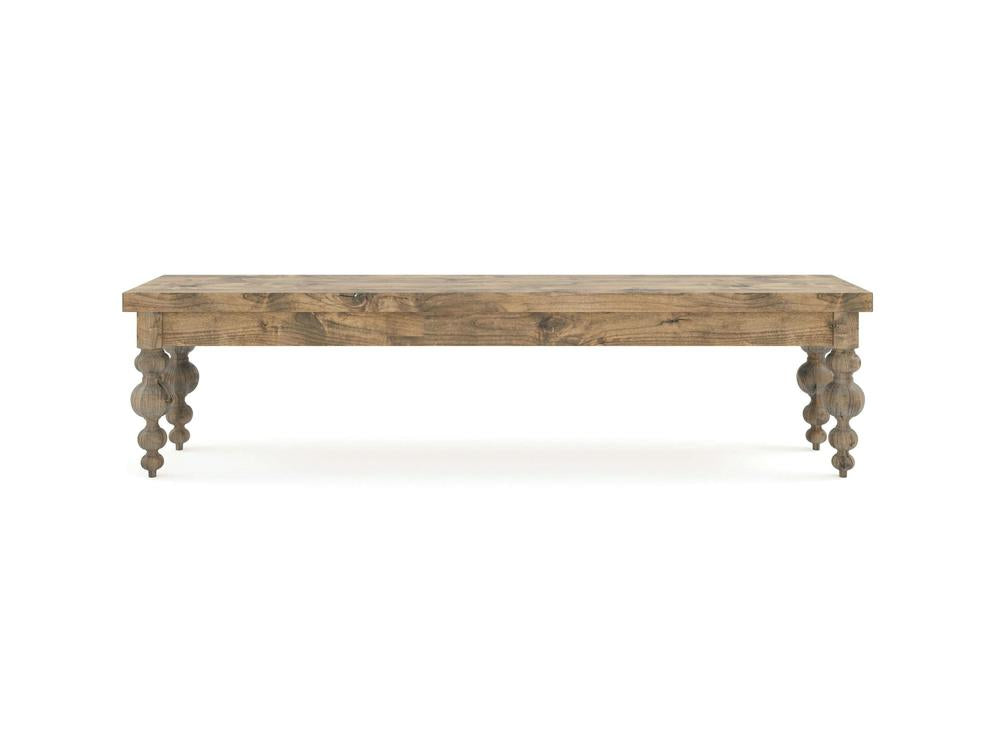 The Olivia Bench - Harvest Wheat on Alder by James+James features a rectangular wooden top, four ornate turned legs, and a rustic natural finish for a simple, classic look.