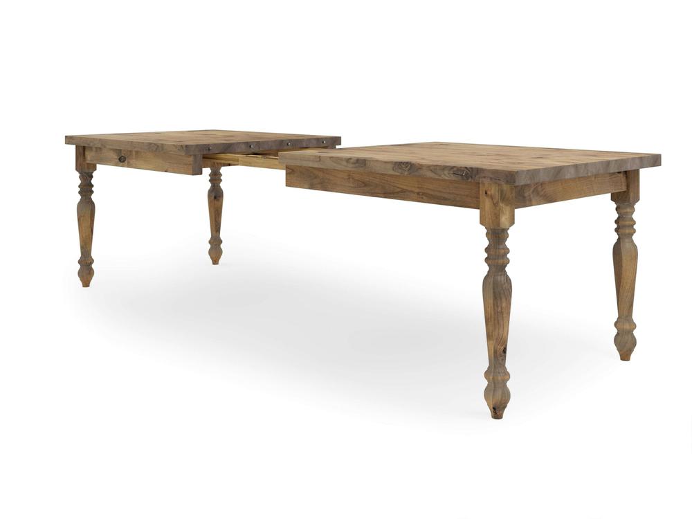 The French Country Expandable Dining Table - Harvest Wheat by James+James is a wooden table with a rustic finish. It features turned legs and includes an additional leaf in the middle to increase its length, as shown in the image where the table is extended.