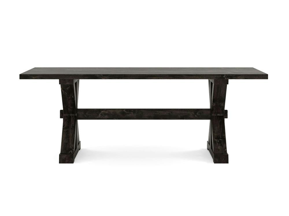 Introducing the Trestle Dining Table - Charred Ember by James+James: This robust table features a rectangular top and sturdy crossed legs connected by a horizontal support beam. Its rustic finish adds character, making it perfect for dining or workspaces. Presented against a plain white background, this piece combines simplicity and functionality in its design.