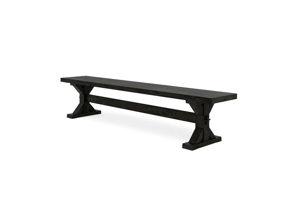 The Trestle Bench - Charred Ember on Alder by James+James features a simple, modern design with a rustic touch, boasting a flat top, sturdy rectangular legs, and a horizontal support beam.