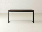 Introducing the Floating Top Sofa Table - Tobacco by James+James: a minimalist wooden table featuring a dark wood top and a black metal frame. This table boasts a rectangular surface and straight, simple legs, elegantly set against a plain, light-colored background.