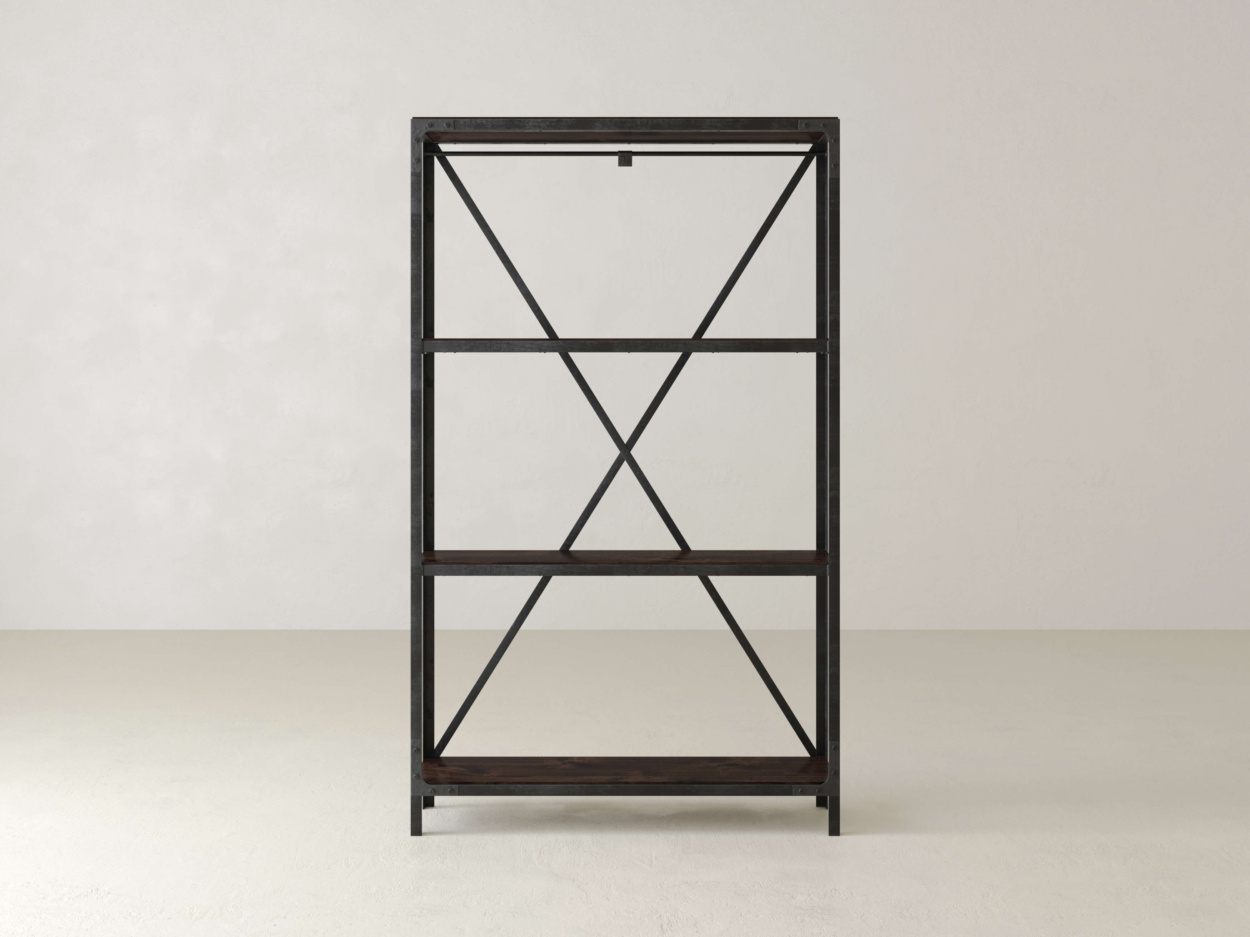 A black metal and dark wood bookcase with an open back design and three shelves against a plain white wall. The frame features X-shaped crossbars for added support.