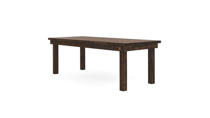 The Farmhouse Dining Table - Tobacco by James+James features a dark wooden rectangular surface supported by four sturdy legs. This table embraces a simple, minimalist design and is shown positioned against a plain white background.