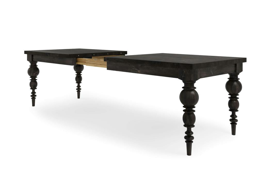The Bailey Expandable Dining Table - Charred Ember by James+James is displayed in a partially extended position, revealing an opening in the middle where additional leaves can be added for extra length. This black, rectangular wooden table features ornate, turned legs.
