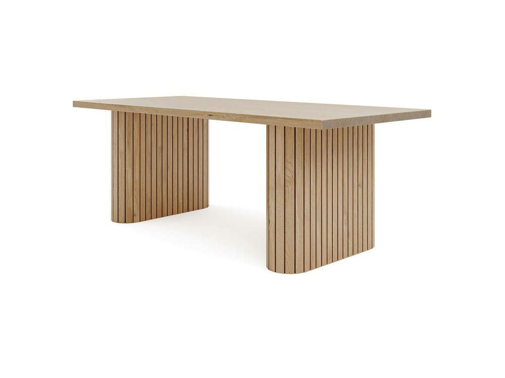 The Fern Dining Table - Satin by James+James is a rectangular wooden piece showcasing a minimalist design with two vertically slatted pedestal bases. Its smooth tabletop and natural light wood finish contribute to its contemporary and clean appearance, making it an ideal addition to modern interiors.