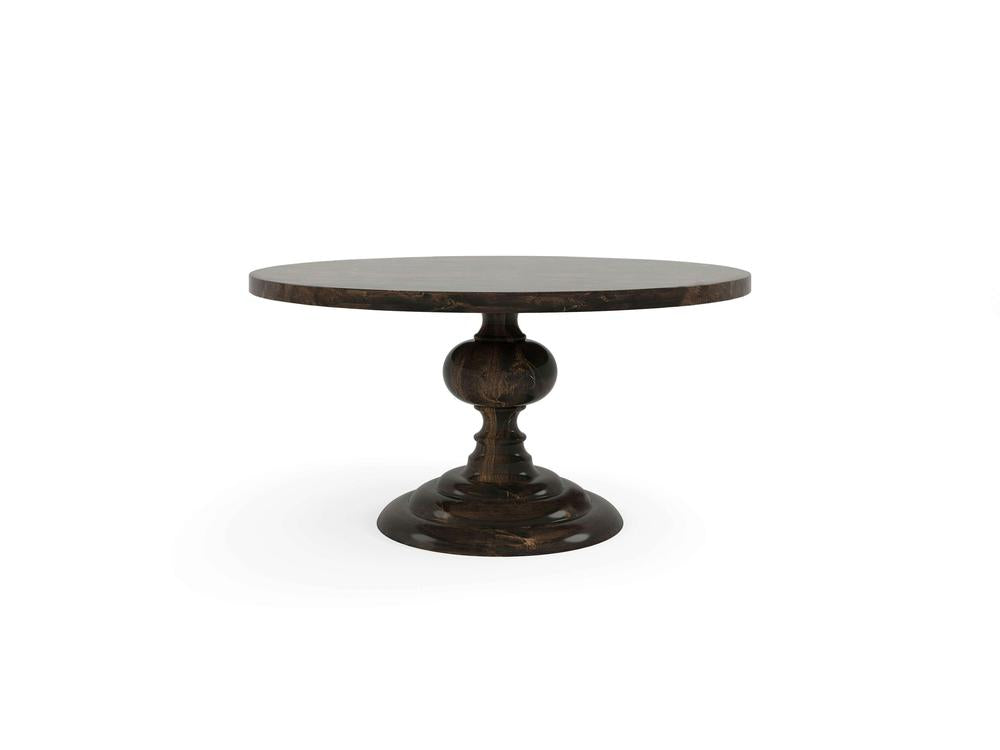 The Josephine Round Dining Table by James+James boasts a smooth, dark brown finish. Featuring a single, ornate pedestal leg with intricate carvings and a circular base that ensures sturdy support, this classic table is elegant and versatile for both dining and decorative use.