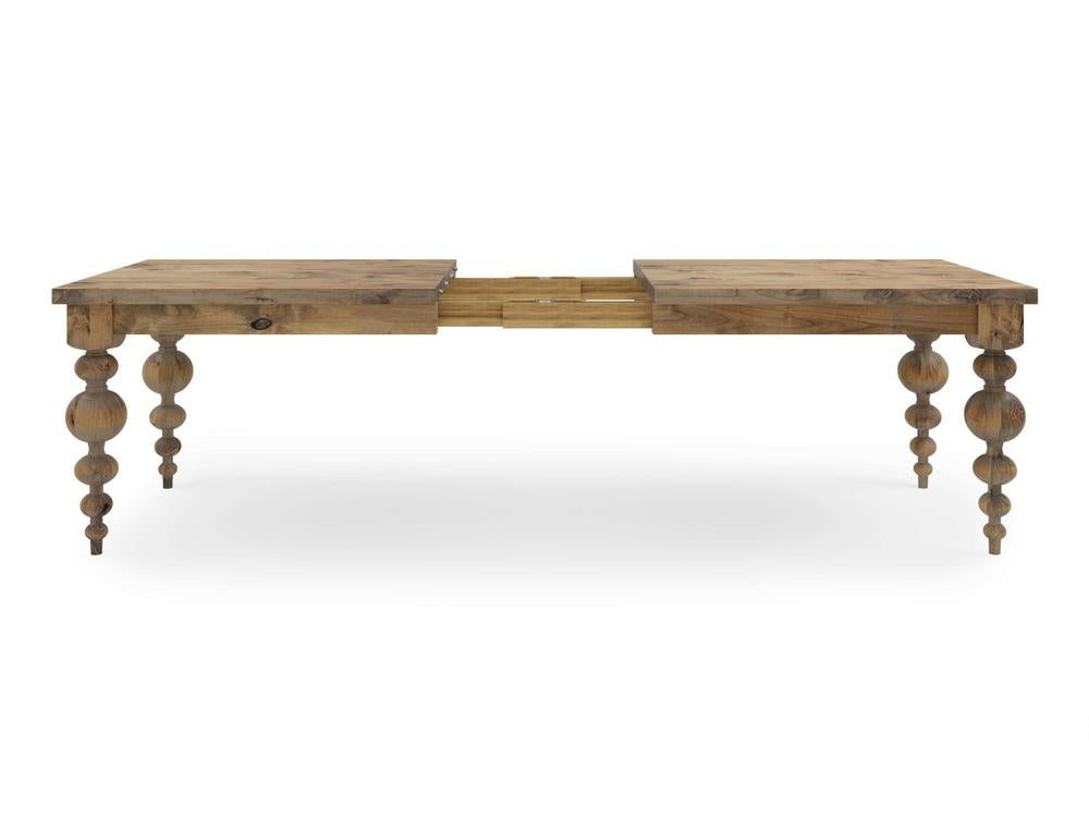 Introducing the Olivia Expandable Dining Table - Harvest Wheat by James+James, an extendable wooden dining table with a rustic finish. It features two rectangular sections and an extendable mechanism in the middle. The table stands on four intricately carved legs with multiple bulbous shapes.