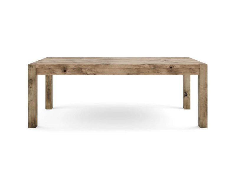 An image of the Jonathan Dining Table - Harvest Wheat by James+James, featuring a rectangular design with a simple, rustic appeal. The table boasts four sturdy legs and a substantial, flat tabletop, all crafted from light-colored wood with visible natural grain patterns.