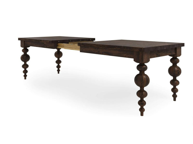 Presenting the Olivia Expandable Dining Table in Tobacco by James+James—a wooden dining table with an ornate design. The table features elaborately carved legs and is shown in its extended position, revealing a gap in the middle. The wood boasts a rich, dark finish.