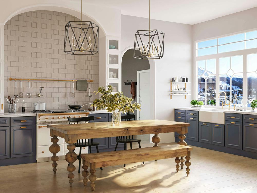 Bright kitchen with blue cabinets, a white tile backsplash, two black chairs, modern geometric pendant lights, and large windows facing snowy mountains, featuring the James+James Olivia Bench - Harvest Wheat on Alder at the wooden dining table.