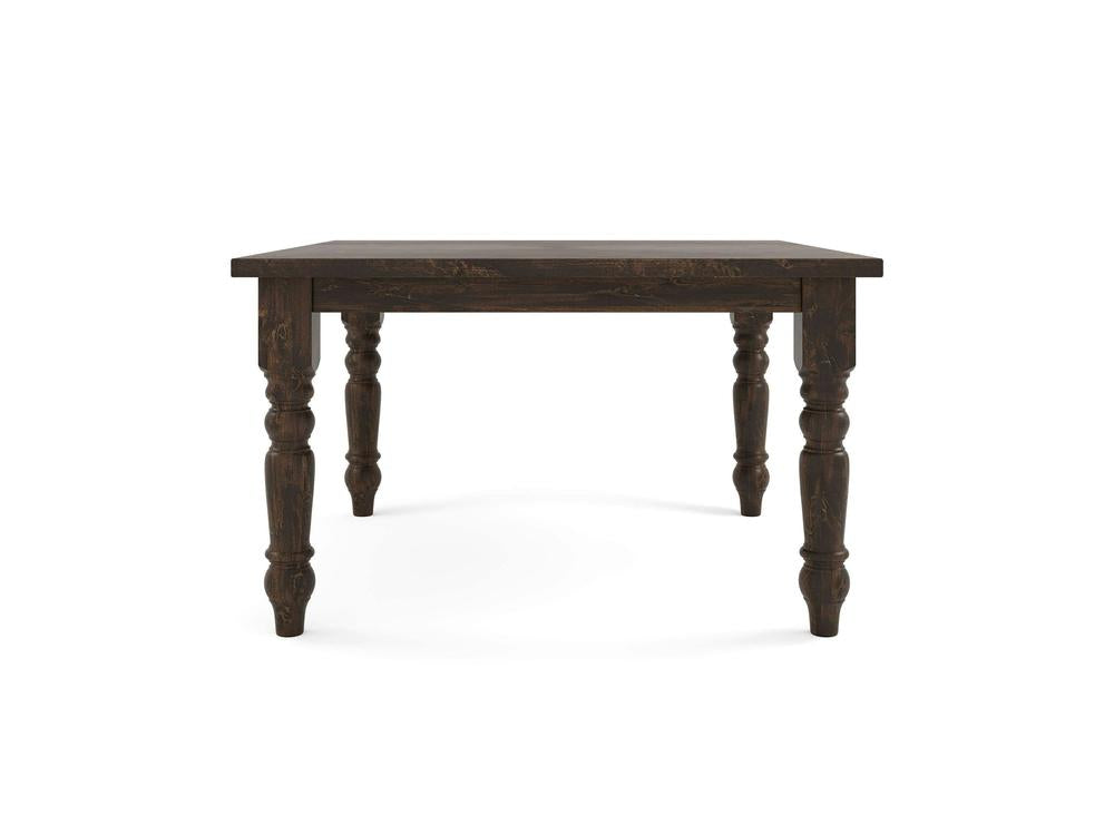 The Baluster Square Dining Table - Tobacco by James+James is crafted from dark wood with a smooth rectangular top and intricately carved legs. Its rustic design features sturdy, rounded legs adorned with decorative details, imparting a classic and timeless appearance.