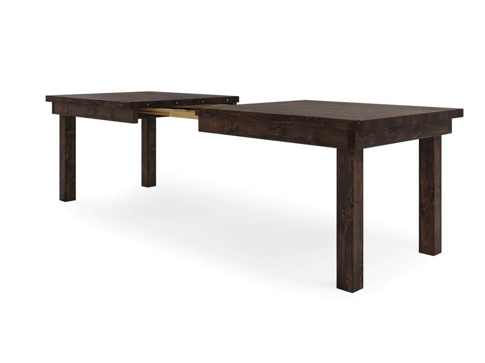 The James+James Farmhouse Expandable Dining Table in Tobacco features a dark wooden finish and stands on four sturdy legs. The table is displayed partially extended with the center section open, revealing the metal extension mechanism between the two ends of the table.