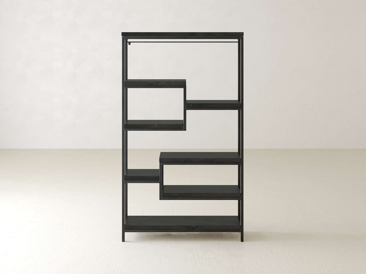 Black, geometric shelving unit with multiple rectangular shelves arranged asymmetrically, set against a plain white background.
