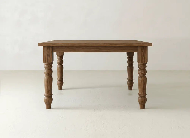 The Fulton Corner Desk - Tuscany by James & James features a smooth rectangular top and four turned legs, shown on a light floor against a plain white background.