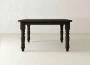 The Fulton Corner Desk - Tuscany by James & James features a dark wood finish, a rectangular top, and four intricately carved legs, displayed against a plain light-colored background.