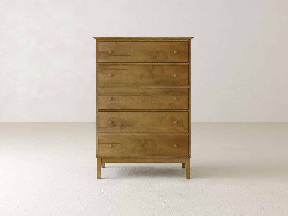 The James & James Bennett Tall Chest, made from solid maple, boasts five spacious drawers with round knobs. It features an elegant design and a natural wood finish, set against a plain light backdrop.