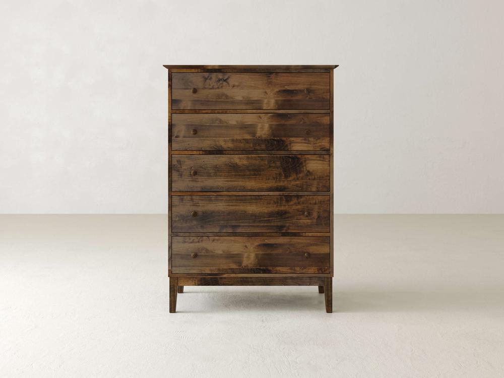 A tall Bennett Tall Chest by James & James, made from solid maple, stands against a white background. With a rich dark finish and visible grain patterns, this rustic dresser has five spacious drawers and offers a simple yet sturdy vintage design.