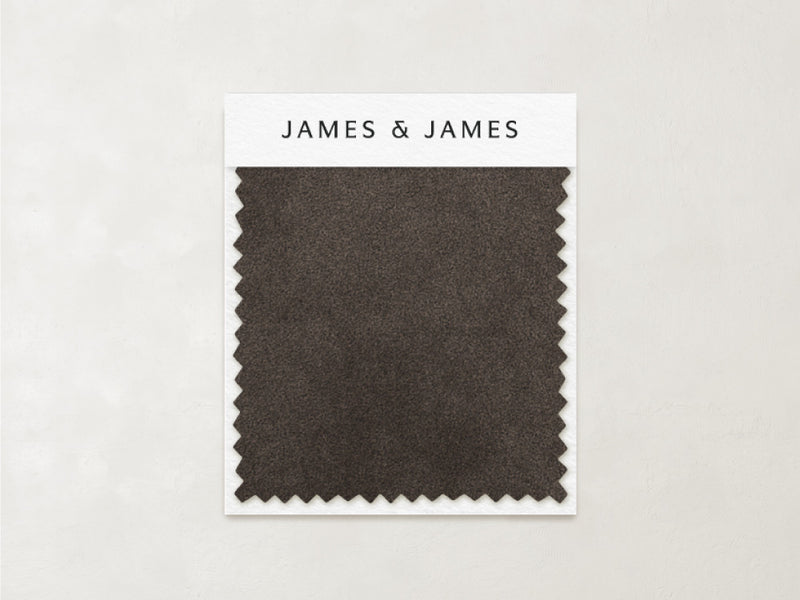 A dark brown rectangular "Mink - Mohair Swatch" with zigzag edges shows its natural texture, attached to a card labeled "James+James" at the top, set against a light background.