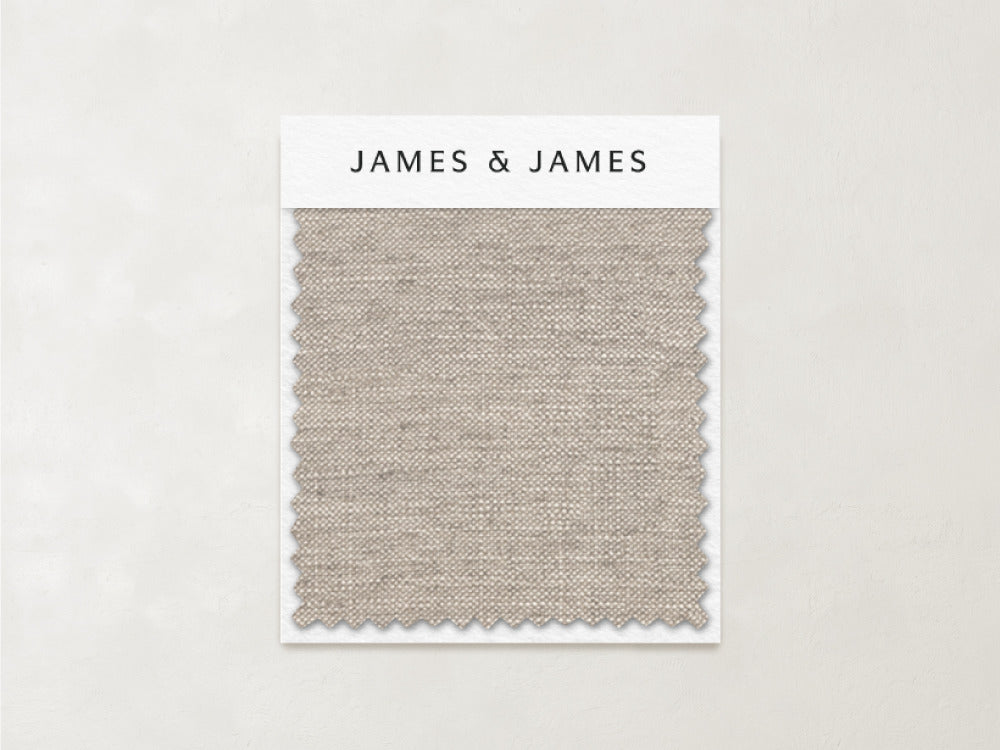 A rectangular swatch of light beige, breathable linen labeled "James+James" and named "Natural - Linen Swatch" is displayed on a card against a plain, neutral background.
