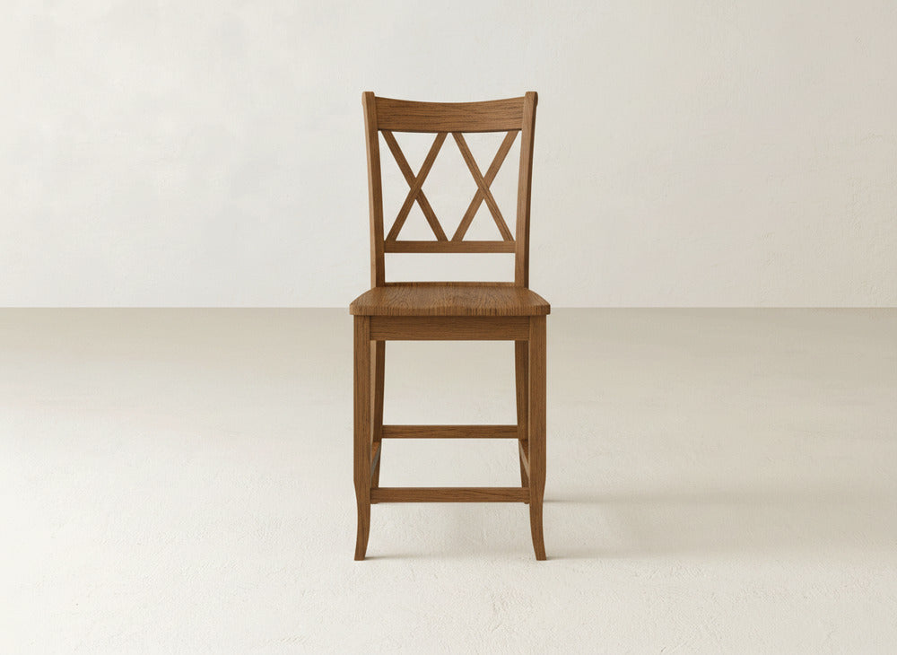 A James & James Double X Back Stool, featuring sturdy construction and curved legs, is centered against a plain, light-colored background.