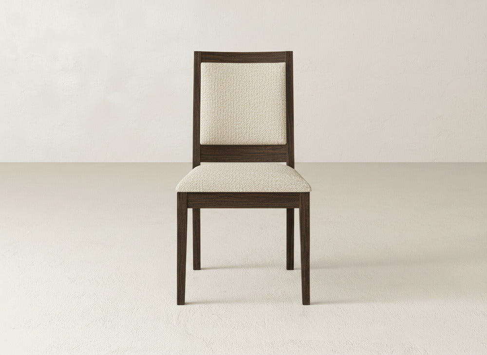 The James+James Gina Side Dining Chair showcases a dark brown maple frame with a light beige upholstered seat and backrest—ideal as a modern dining chair for any space.