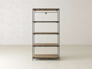 A minimalist wooden shelving unit with five shelves is set against a plain, light-colored wall. The shelves are supported by a black metal frame, creating a simple and modern design.