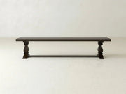 The Heirloom Bench by James+James features a rectangular oak seat in an espresso finish and turned legs, shown against a plain light-colored background.