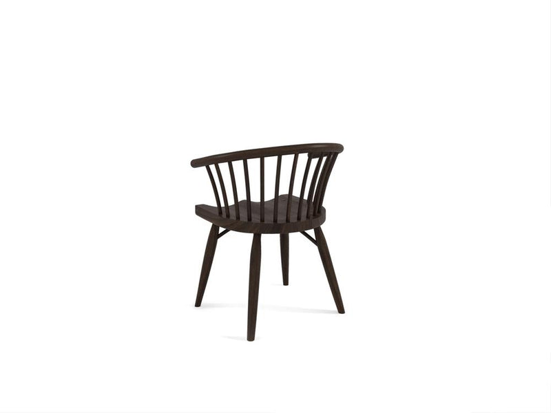 A dark wooden chair with a curved backrest and vertical slats, featuring four tapered legs, is positioned against a plain white background. The chair has a minimalist and modern design.