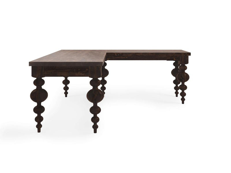 Close-up view of the Olivia Corner Desk - Tobacco by James+James reveals a rich, dark brown wooden surface. The prominently visible wood grain creates a natural pattern with various shades of brown, from light to dark, giving the desk a warm and rustic appearance.