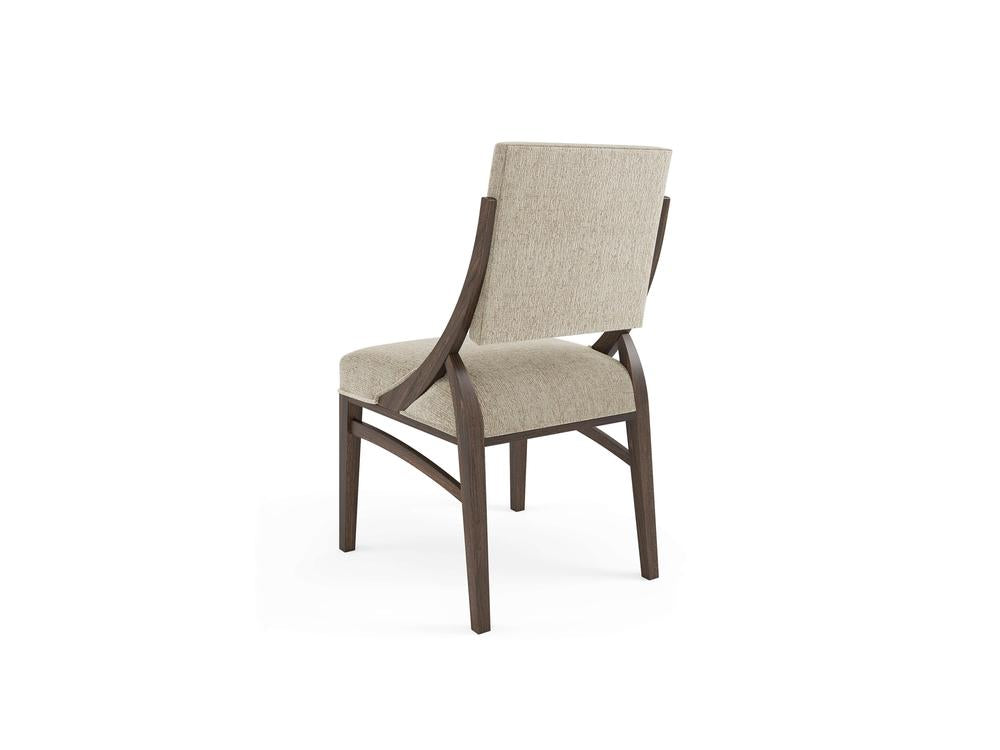 A beige upholstered chair with a wooden frame, viewed from the back. The chair features a cushioned seat and backrest, with the wooden legs and supports in a dark brown finish.