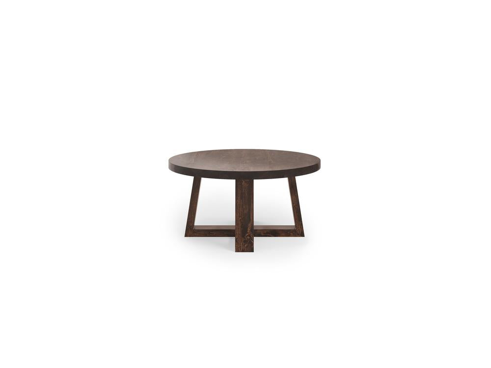 The Rae Coffee Table - Tobacco by James+James features a round wooden design with a dark finish. This coffee table has three angular legs that support its circular tabletop, all set against a white background.