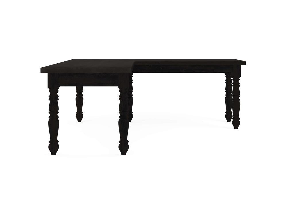 The Turned Leg Corner Desk - Charred Ember by James+James features a dark wooden design with intricately turned legs. Its L-shaped tabletop offers a distinctive style, beautifully showcased against a plain white background to emphasize its craftsmanship and elegance.
