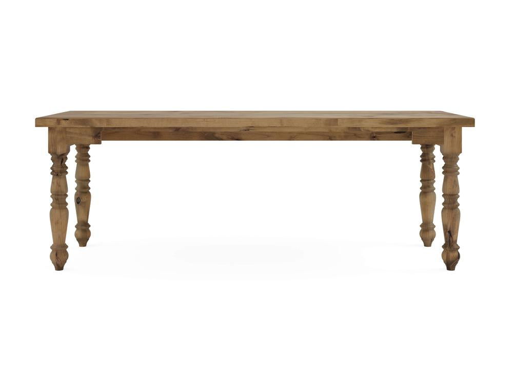 The Turned Leg Desk by James+James features a rectangular top and four intricately carved legs. Finished in Harvest Wheat, it beautifully showcases the natural wood grain with its simple and classic design.