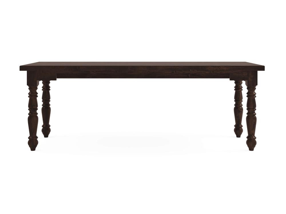 A Turned Leg Desk in a tobacco finish, featuring ornately carved legs by James+James, set against a white background.