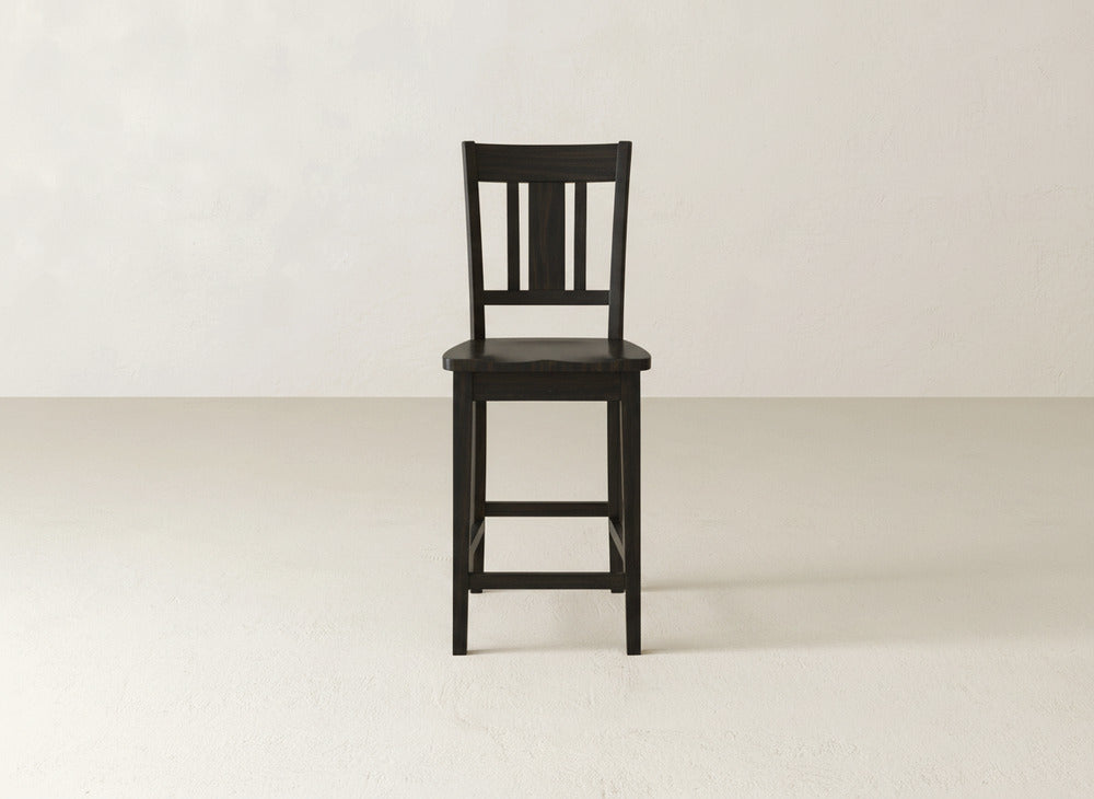 The William Stool by James & James features a handcrafted dark wood frame, slatted backrest, and square seat—ideal for enhancing any home decor.