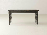 A dark wooden James+James Abigail Sofa Table with a rectangular top and four intricately carved legs is set against a plain, light-colored background. Its timeless charm is evident in the classic and robust design.