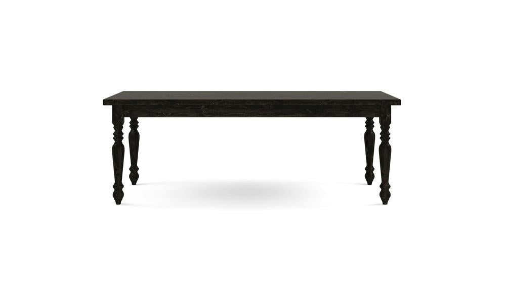 A medium-sized, rectangular French Country Dining Table - Charred Ember by James+James, featuring intricately carved legs and a sleek black wooden finish, set against a plain white background.