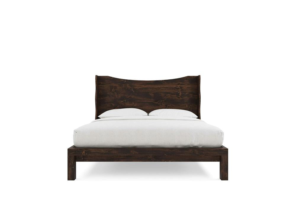 The Harlow Bed by James+James, crafted from alder with a tobacco finish, features a high, curved headboard. It is shown neatly made with white bedding and pillows against a plain white background.