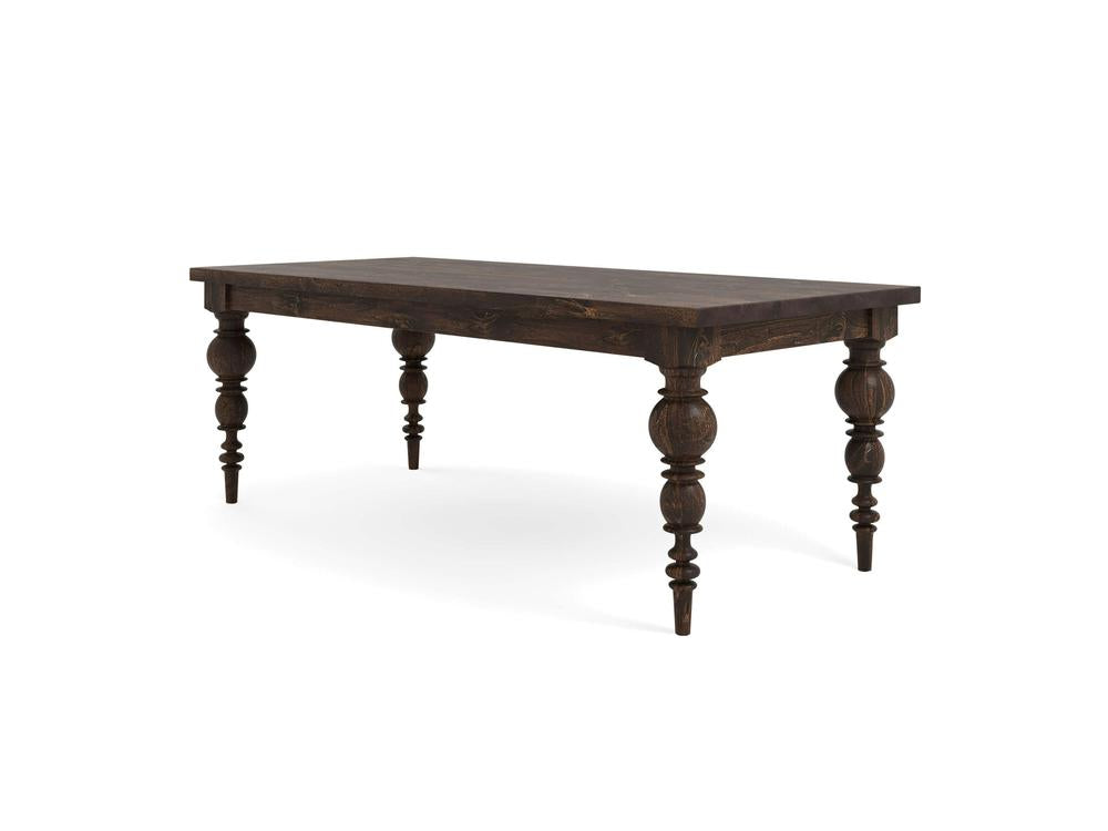 The Bailey Dining Table - Tobacco by James+James features a dark wooden rectangular tabletop with a rich, textured wood grain and intricately carved, turned legs. Combining a rustic and traditional aesthetic, the table rests sturdily on four decorative legs.