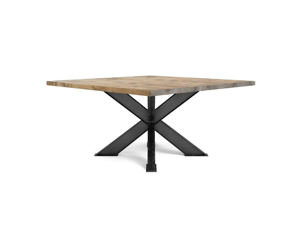 The Shiloh Square Dining Table - Harvest Wheat by James+James features a light brown wooden top and a black X-shaped metal base, elegantly set against a plain white background.