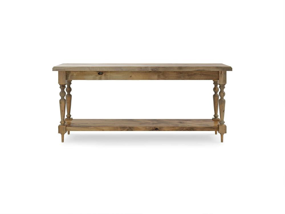 The Ella Sofa Table - Harvest Wheat from James+James showcases a rectangular wooden top, a single drawer equipped with a round knob, intricately carved legs, and an open bottom shelf. The table is elegantly set against a white background.