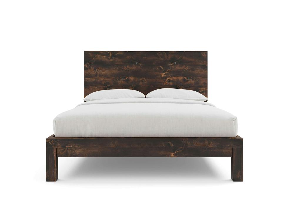 The Sawyer Bed - Tobacco on Alder by James+James features a wide headboard, dark brown wooden frame, two white pillows, and a neatly made white duvet, all photographed against a plain white background.