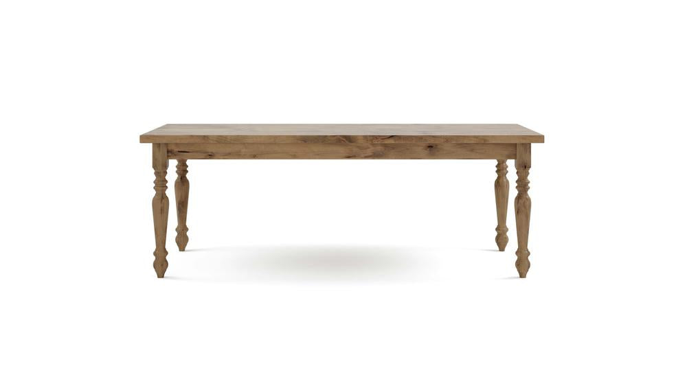 The French Country Dining Table - Harvest Wheat by James+James is displayed against a white background. It features a rectangular wooden top and four turned legs with a natural wood finish that beautifully highlights its grain pattern.