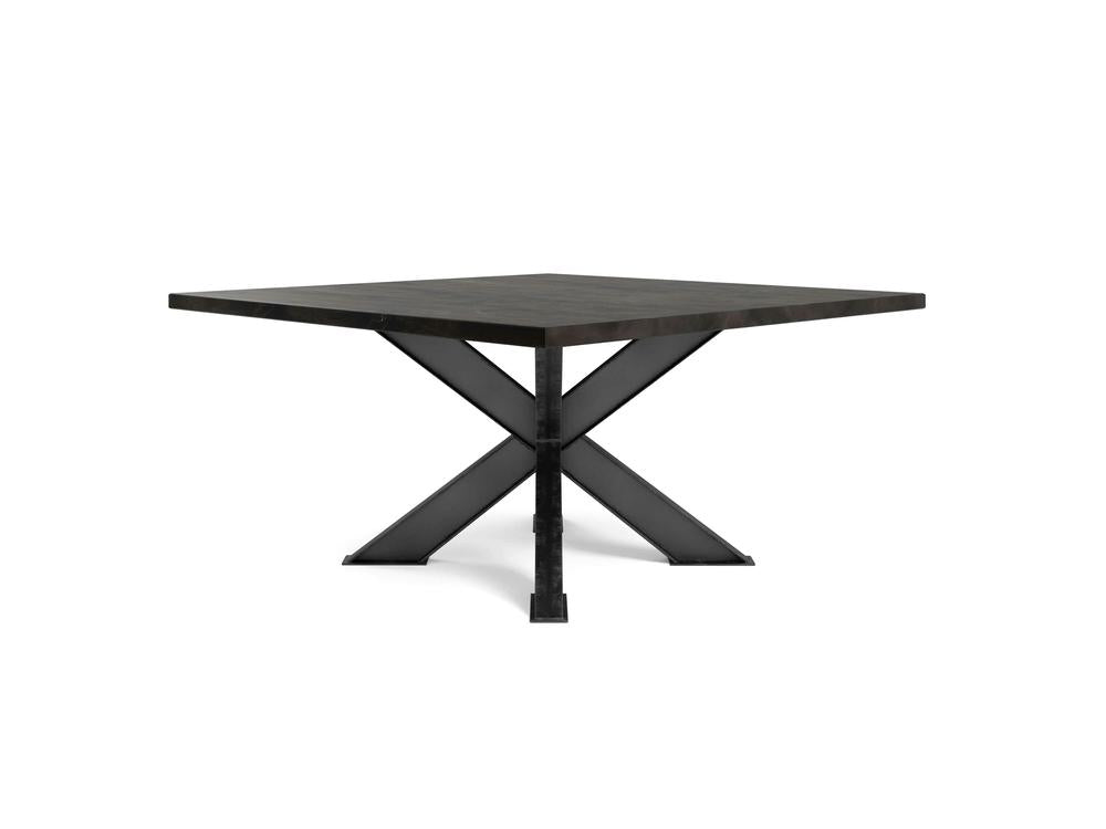 The Shiloh Square Dining Table - Charred Ember by James+James features a sleek, dark wooden top and a black, metal X-shaped base. This minimalist design is showcased against a plain white background.